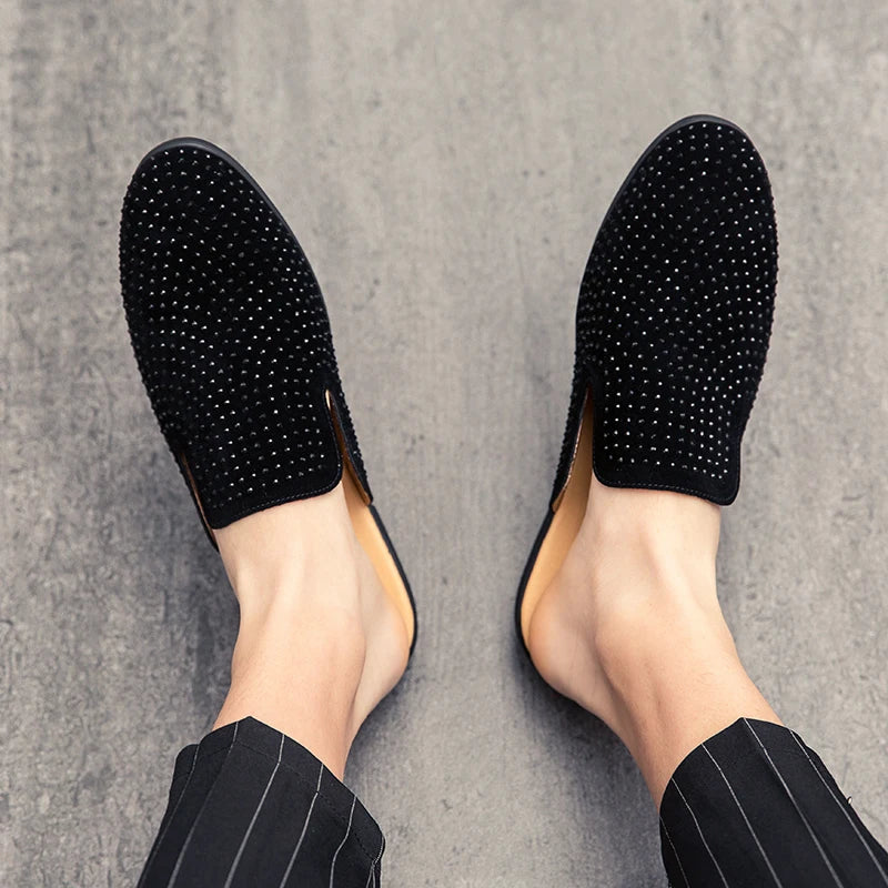 POV of black mule loafers for men